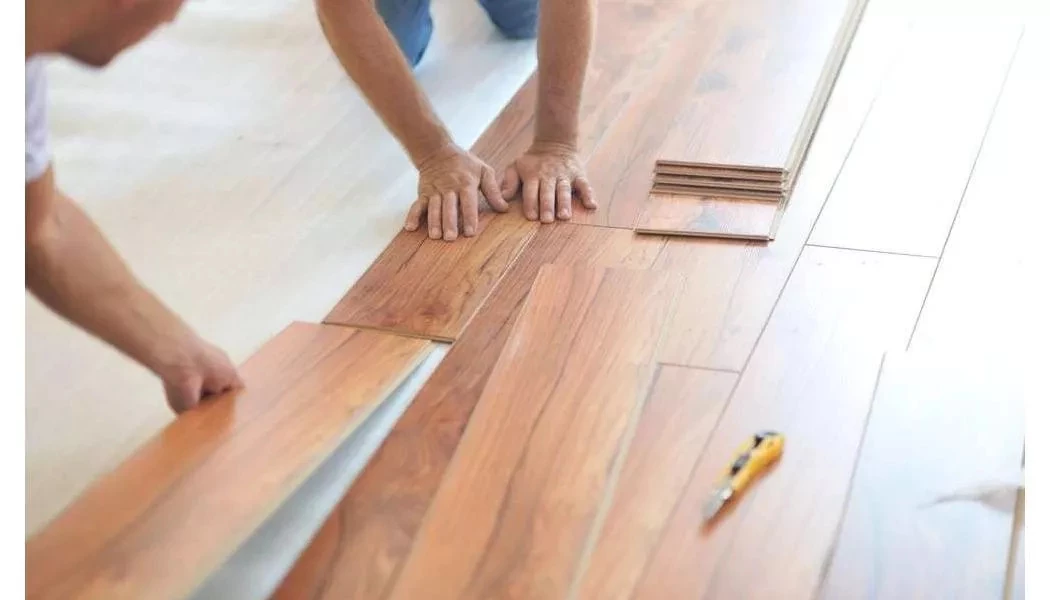 Engineered wood planks being connected during installation